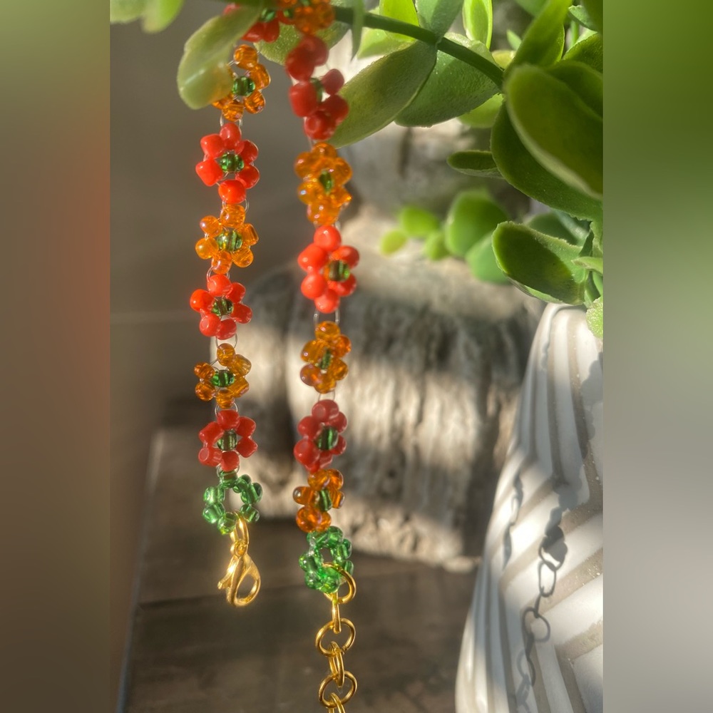 Handmade orange green beaded daisy bracelet